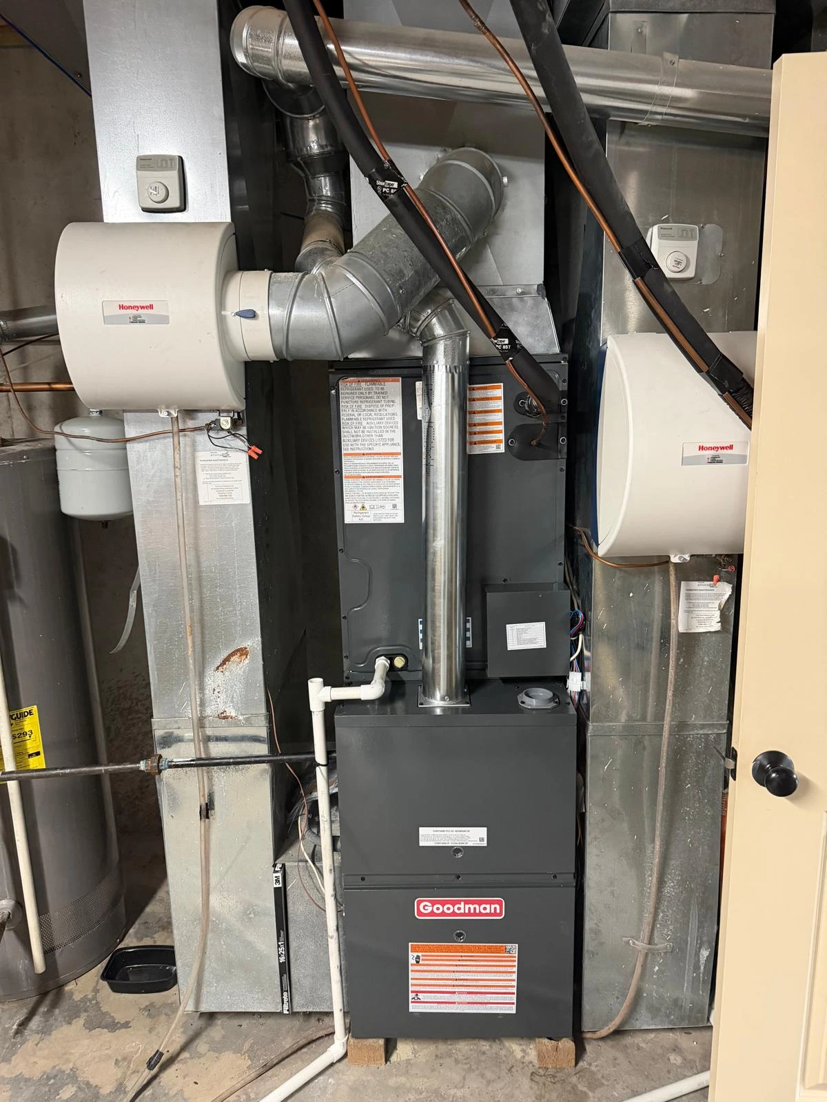 Goodman residential furnace setup featuring integrated Honeywell bypass humidifier
